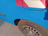 a blue truck with a red and white stripe painted on the side of it