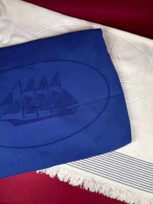 a blue towel with a picture of a ship on it