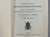 an open book with a picture of a bug on it