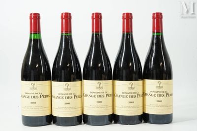 six bottles of wine are lined up on a white surface