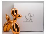 une image représentant un chien en forme de ballon doré assis à côté d'une boîte blanche