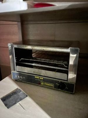 a toaster oven sitting on a counter in a kitchen