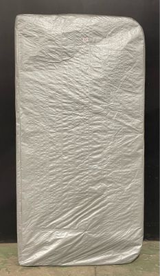 a close up of a mattress with a sheet covering it