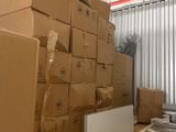 many boxes stacked on top of each other in a storage room
