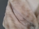 an image of a mannequin mannequin wearing a fur stole