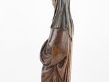 an old statue of a woman with a veil on her head
