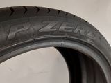 a close up of a tire on a white surface