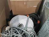 a cardboard box filled with a bunch of hoses