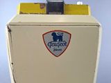 a white refrigerator with a blue and yellow label on it