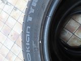 a tire that is sitting on a tile floor