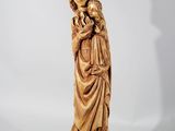 a statue of a woman holding a child in her arms
