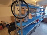 a room that has a bunch of shelves in it