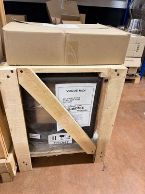 a stack of boxes sitting on top of a wooden table