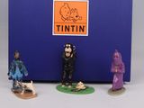 three figurines of a man and a woman in front of a tin tin tin tin tin tin tin tin tin tin tin tin tin tin tin tin