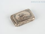 a silver box with a picture of a deer on it
