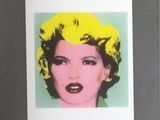 framed photograph of a woman with yellow hair and a green background