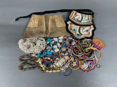a bag full of assorted jewelry on a table