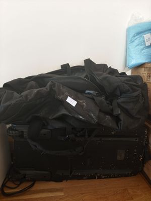 a pile of luggage sitting on the floor next to a wall