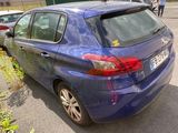 a blue car that is parked on the side of the road