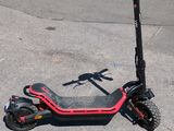 a scooter that is sitting on the street