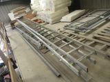 a large pile of metal and wood in a warehouse