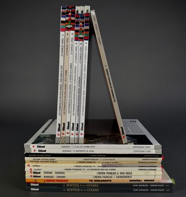 several books stacked on top of each other on a table