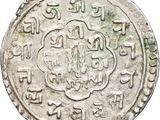 a close up of a silver coin with writing on it