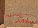 graffiti on the wall of a building with a red spray painted on it