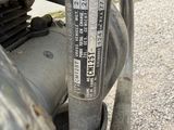 a close up of a motorcycle with a number plate on it