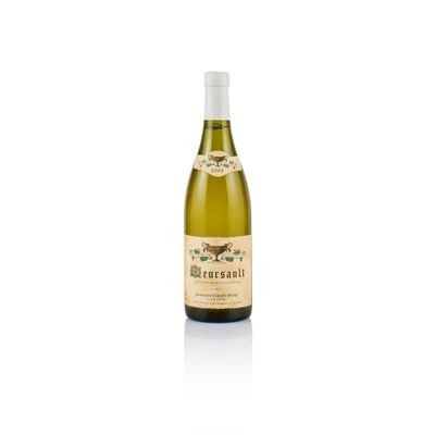 a bottle of white wine sitting on top of a white table