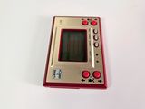 a small red and silver electronic device on a white surface