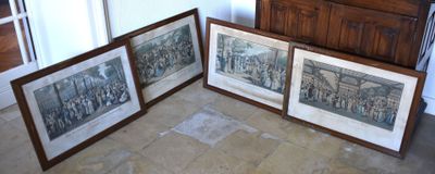 three framed pictures on the floor of a room