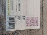a picture of a piece of fabric with a price tag on it
