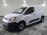 the white van is parked on a checkered tile floor