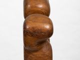 an image of a wooden sculpture sitting on top of a white pedestal