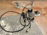 a table that has a bunch of wires on it