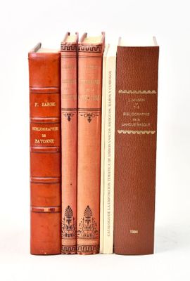 three books that are sitting next to each other on a table