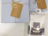 two boxes of towels and a bag of flour on a table