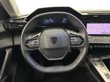 the interior of a car with a steering wheel and dashboard controls