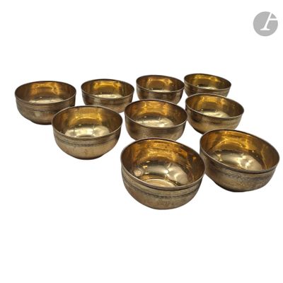 many bowls that are lined up together on a white surface