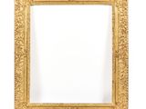 an antique gold frame with a white background