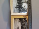 two old photos hanging on a wall next to a ruler