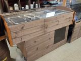 a wooden counter with a glass top in a restaurant