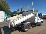 a white truck that is sitting in the dirt