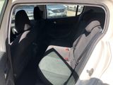 the back of a car with the door open and the seats down