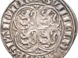 une vieille pièce d'argent ornée d'une croix