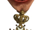 l'image d'une médaille surmontée d'une étoile