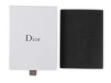 a black and white book with a bee on it next to a white box