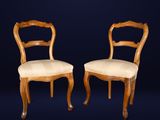 pair of antique chairs with upholstered back and upholstered seat