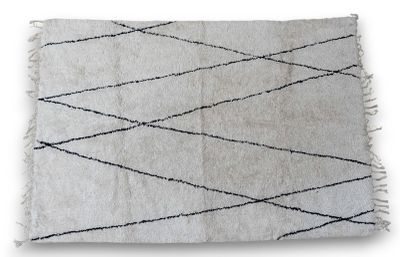 a close up of a white and black rug on a white background